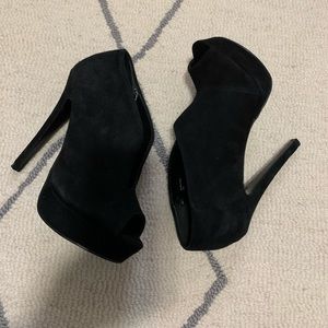 Black suede high heels.